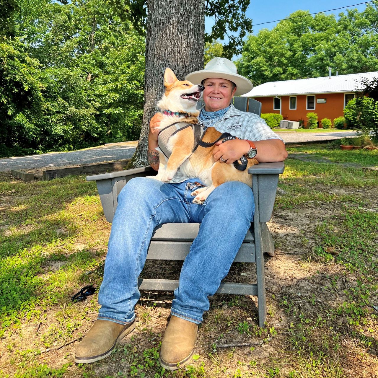 Lady sitting with a dog on her lap